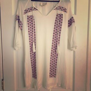 White dress with red and blue embellishments