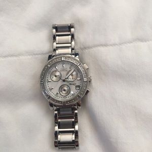 Invicta watch with mother of pearl face.