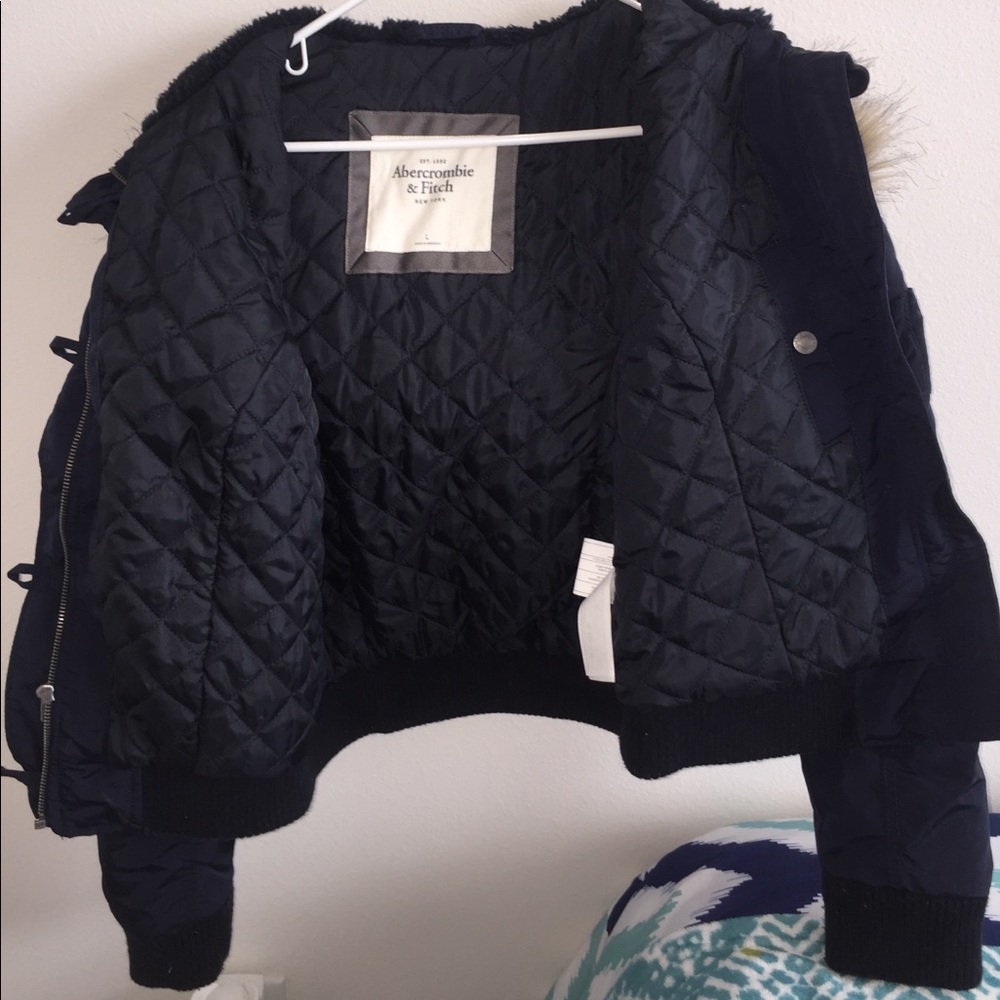 Heavy winter jacket with detachable furry hood