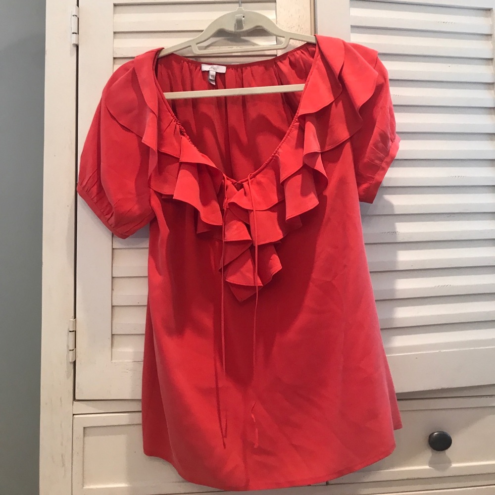 Silk blouse with ruffles.