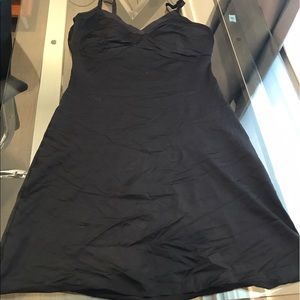 Black SPANX half slip with adjustable straps.