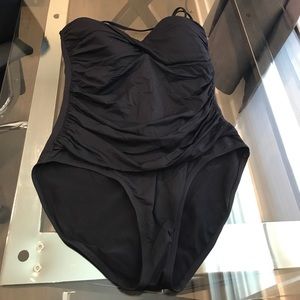 Black full piece suit with flattering touching.