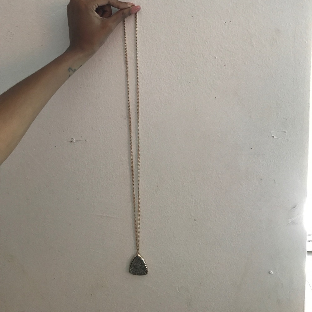Long gold chain with pendant