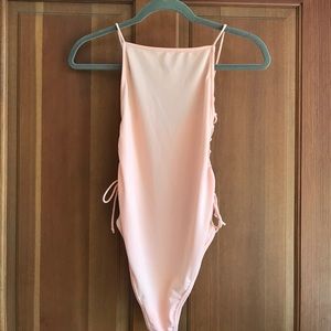 Peach body suit