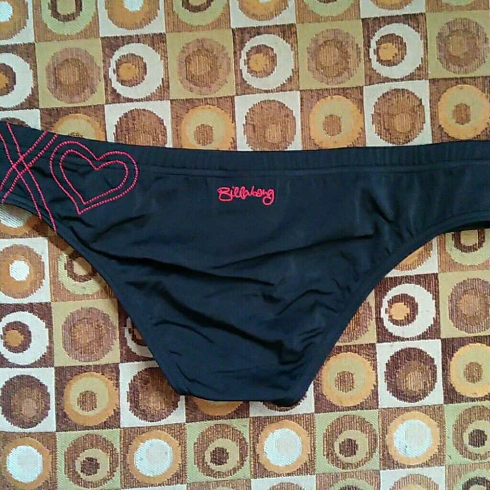 Billabong low rise swim bottoms. Black with red