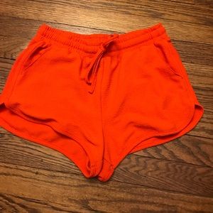 Orange track shorts