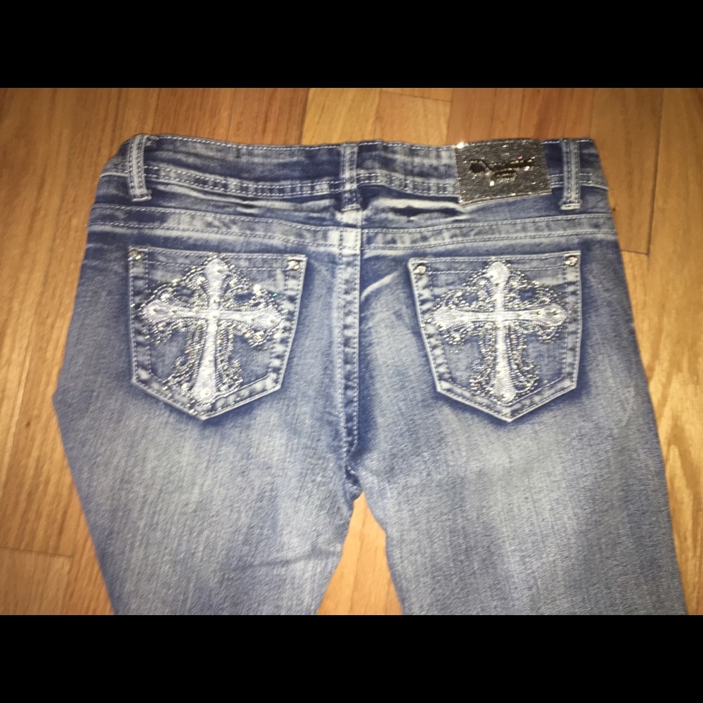 Cute jeans, silver cross stitched on back pockets