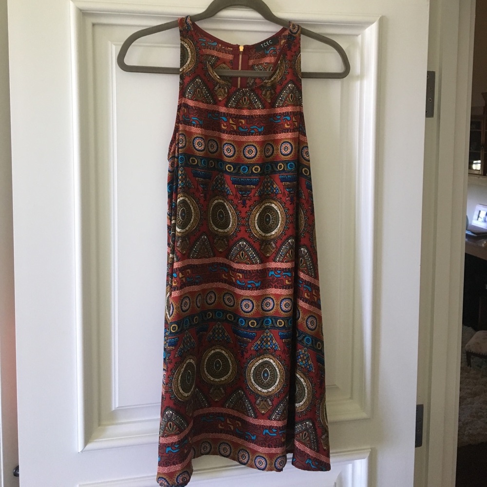 Ethnic patterned dress with a gold zipper.