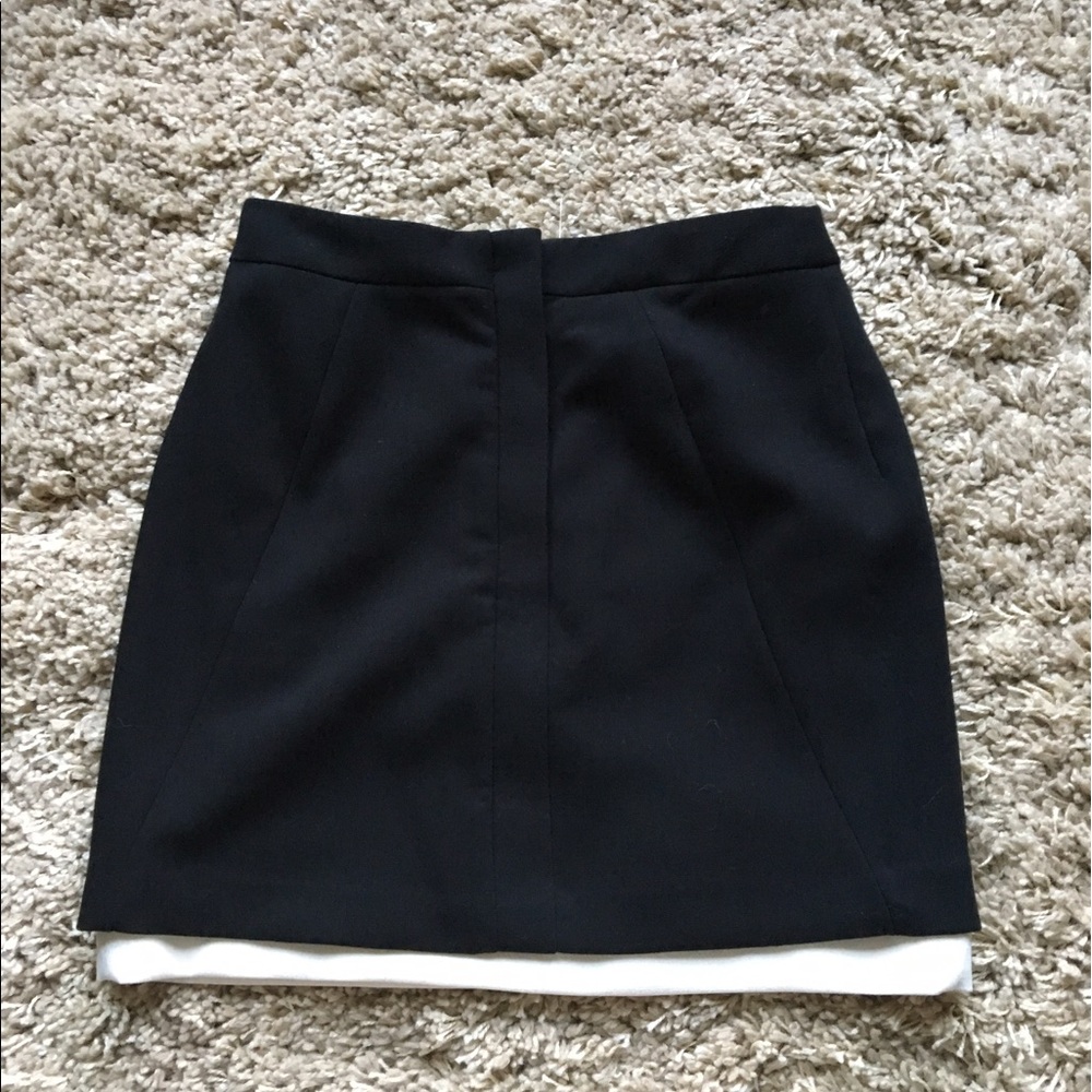 Black mini skirt with beautiful white underline.