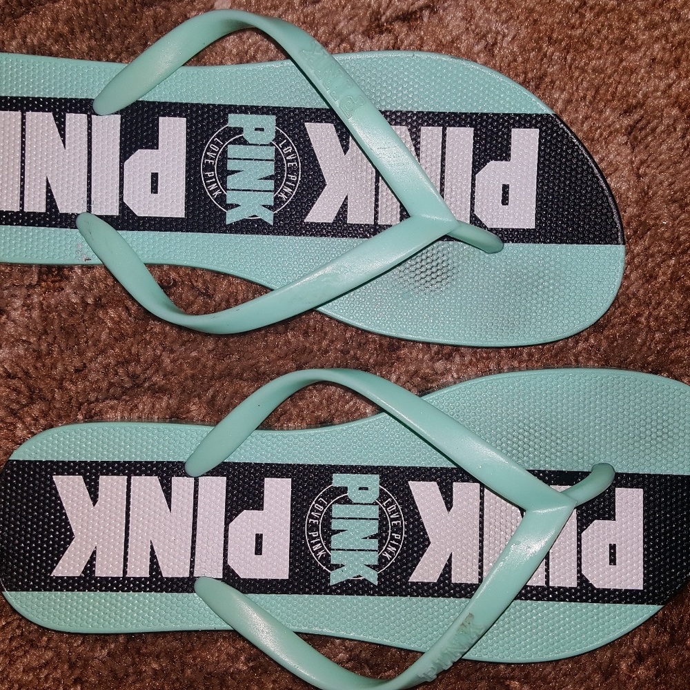 Victoria's secret pink flip flops. Worn once.