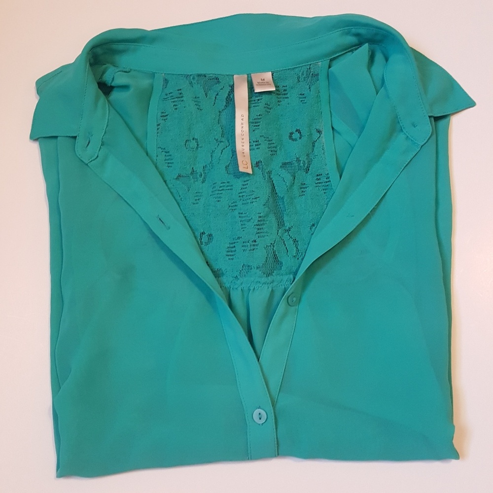 Beautiful sheer blouse with lace back.