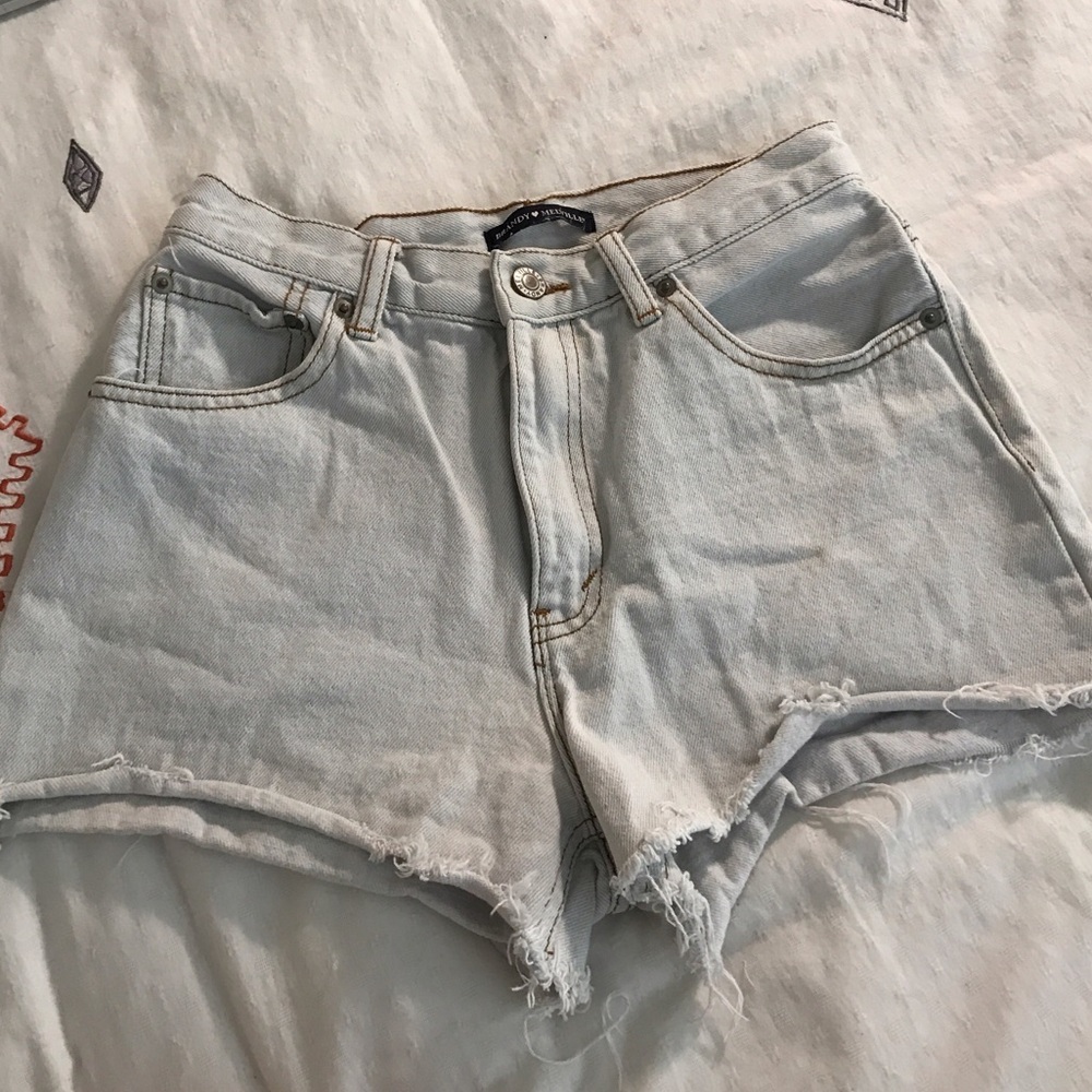 Brandy Melville light wash cut offs