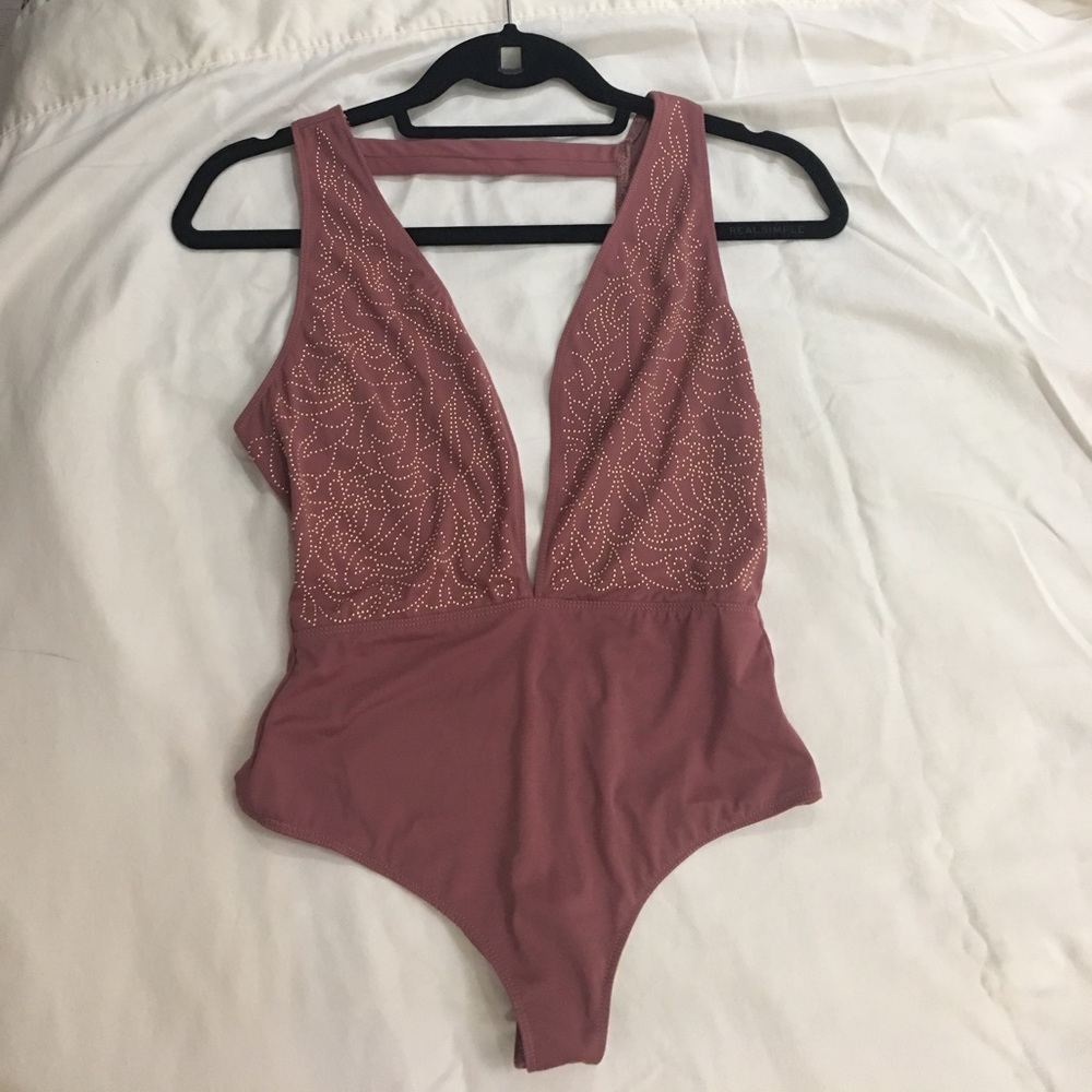 Pink body suit