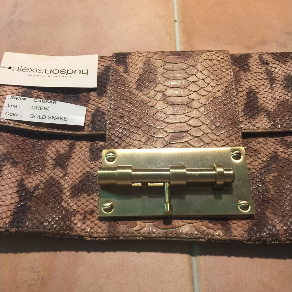 Alexis Hudson gold snake clutch