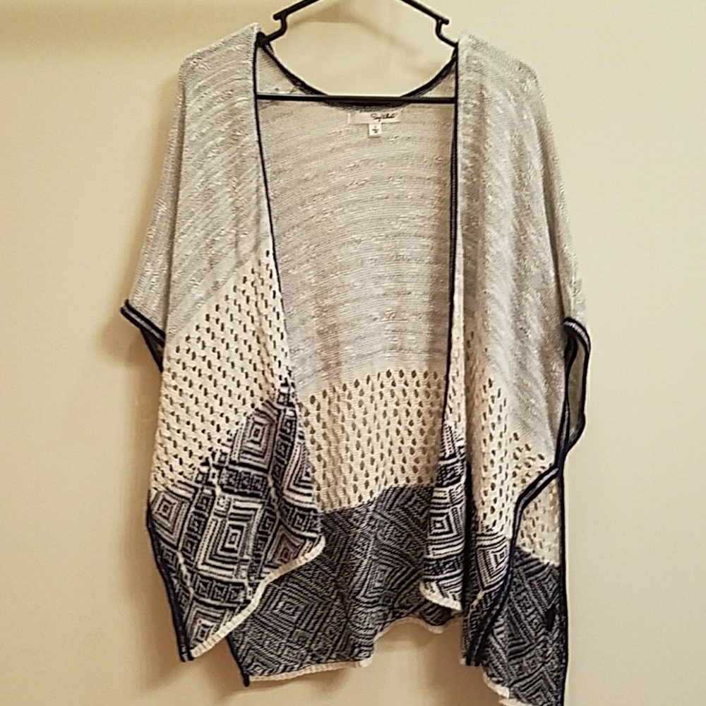 Cape: Grey, tan, and blue. Amazing design & detail