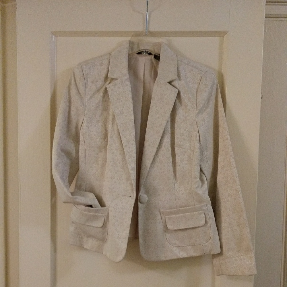 Blazer made with textured fabric.