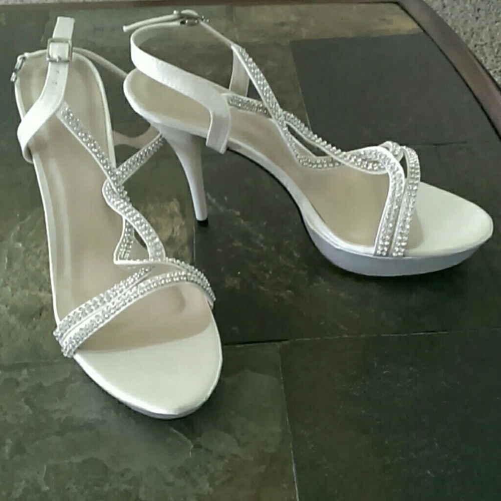 White satin bridal or dancing shoes.