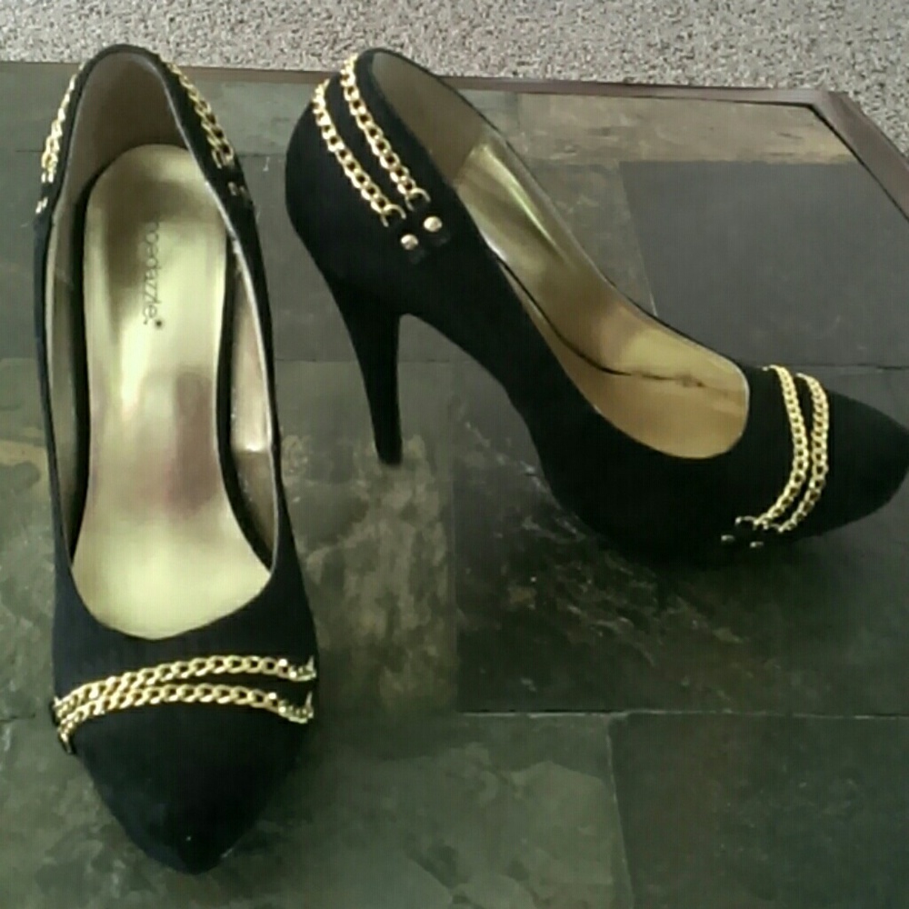 Black soft suede 5"pump wirh gold chain accents.