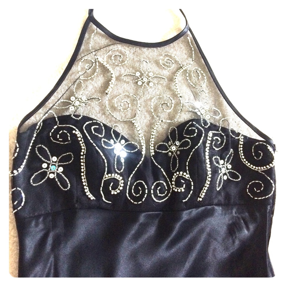 Black silk with lace detail.  Full length dress.