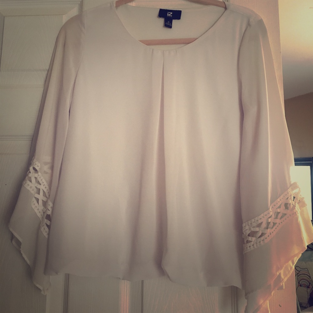 Never worn white blouse, with flare in the arms