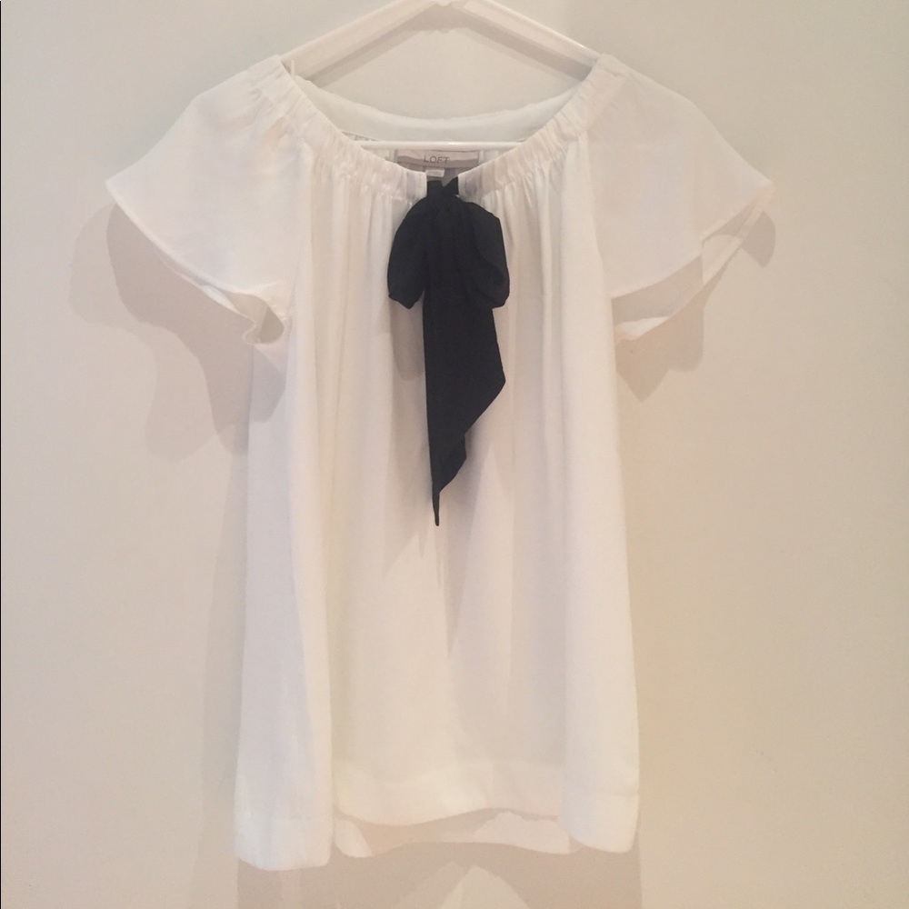 White chiffon flowing top with black bow