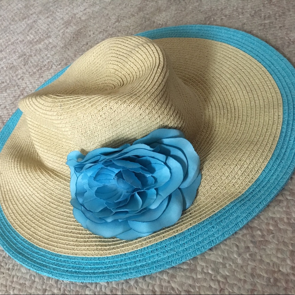 Tan and light blue floppy beach hat.