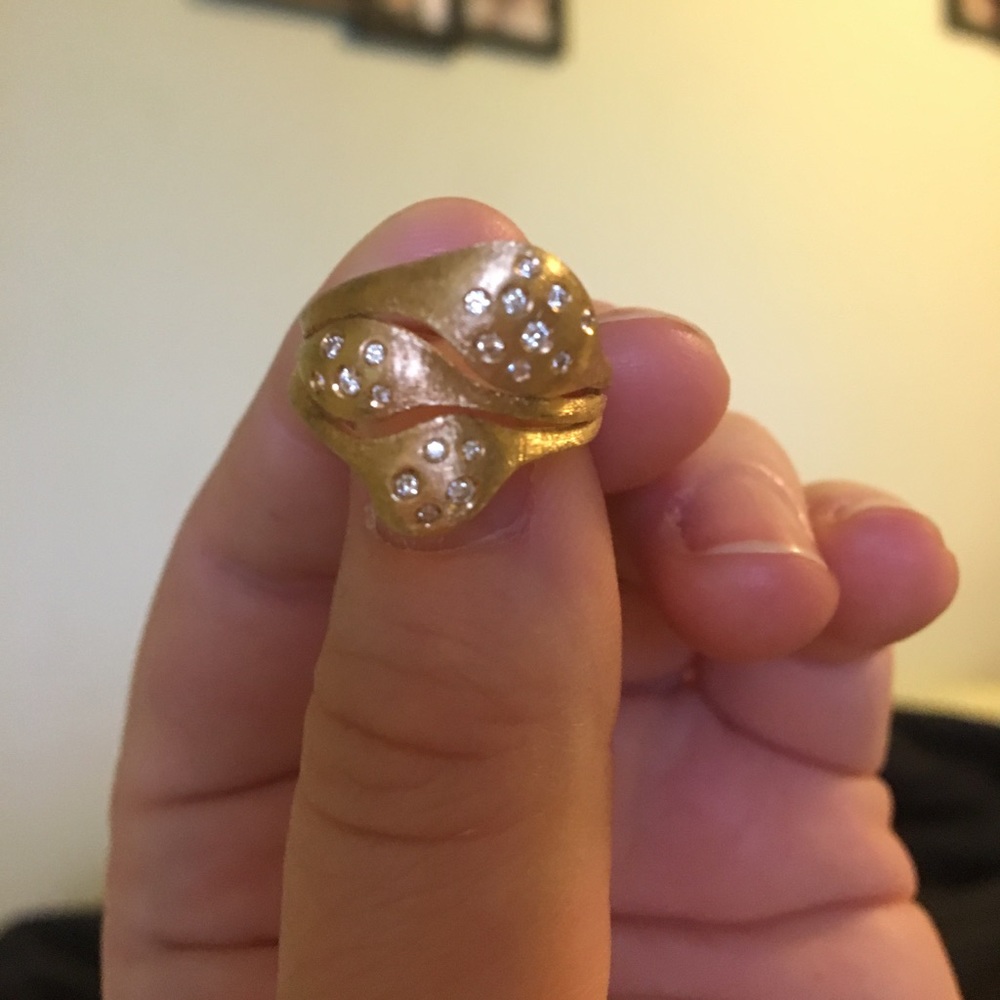 A size seven NANIS brand engagement ring