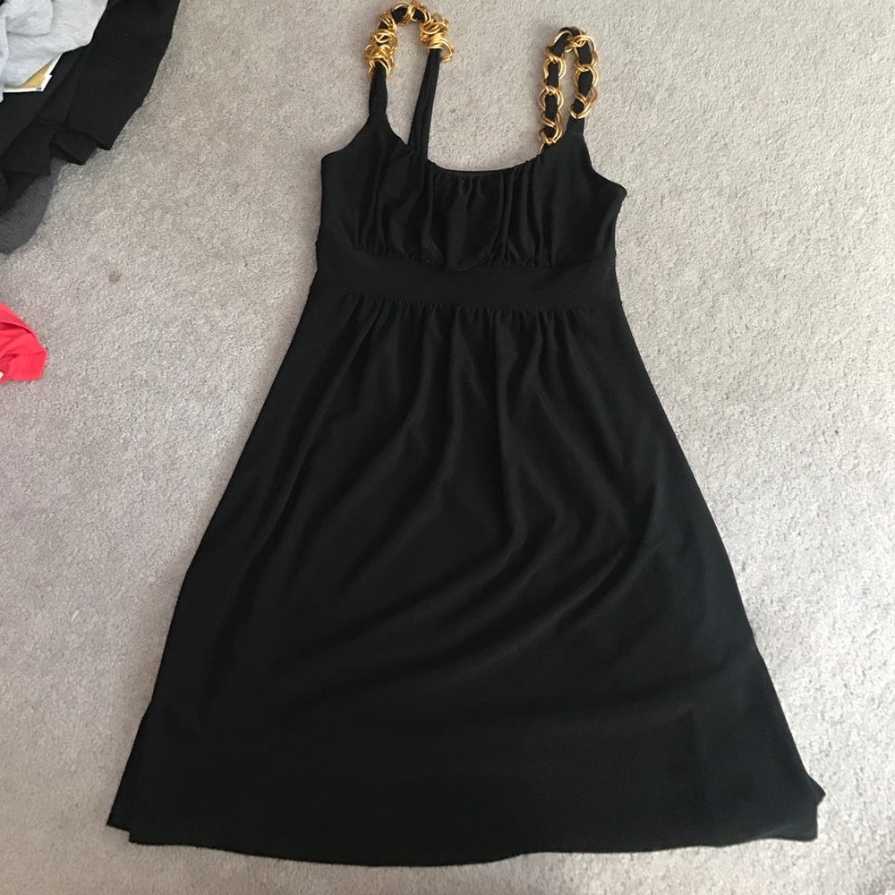 Black dress with gold chains in the straps