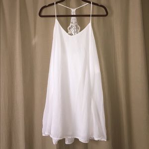 White chiffon dress with lace back.