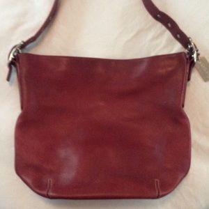 Small red leather coach shoulder bag.