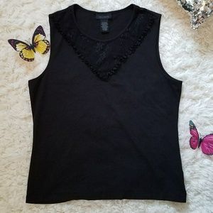 Sleeveless top with sheer lace neckline detail