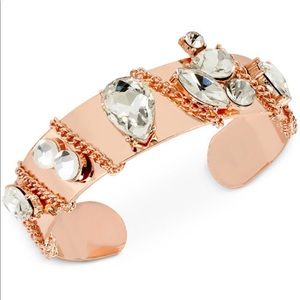 Gleaming chain link make around a bold bracelet.