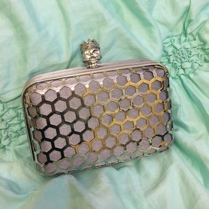 Charming Charlie silver skull clutch