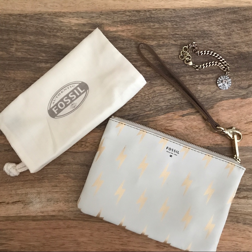 Fossil gold and bone lighting leather wristlet!