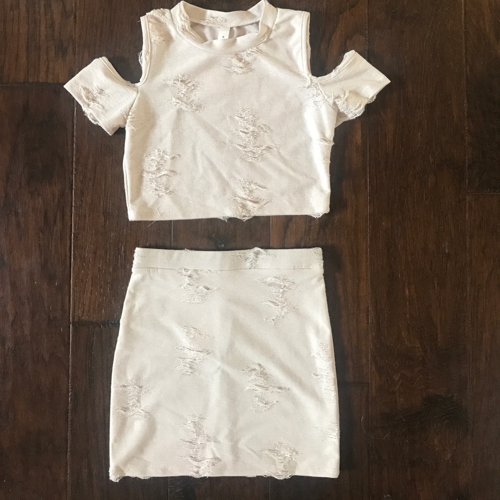2 piece distressed top and skirt.