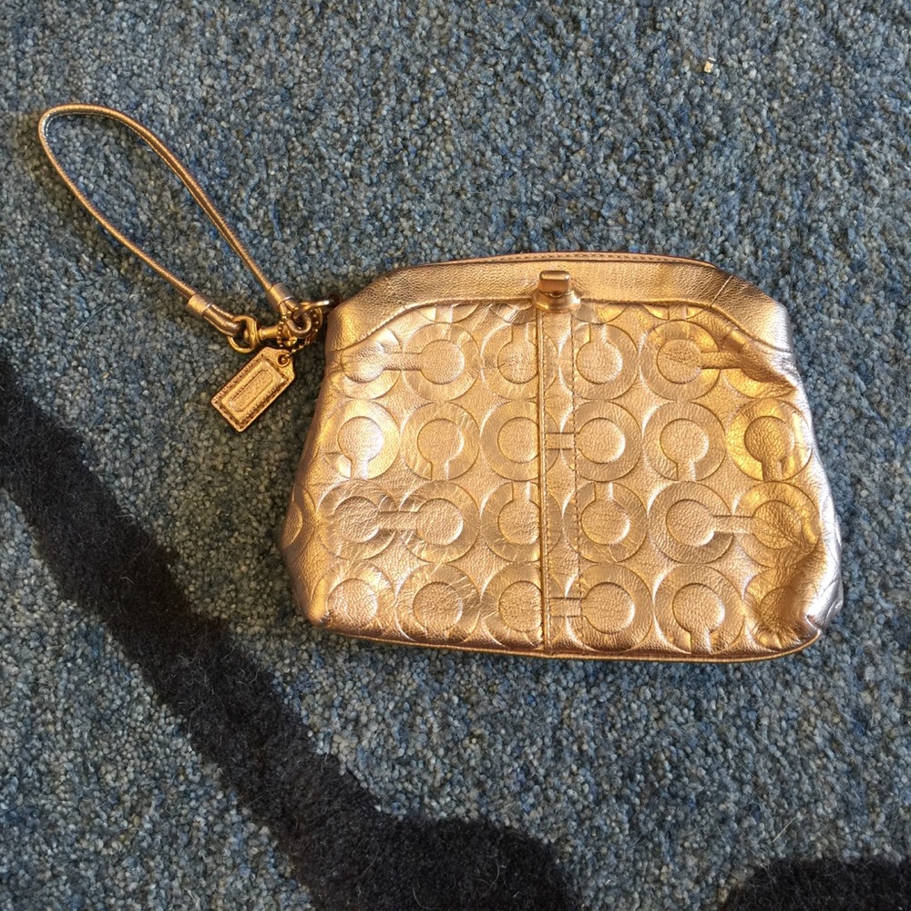Coach rose gold clutch
