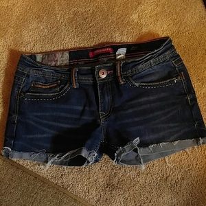 Woman's blue jean shorts with unique patterns