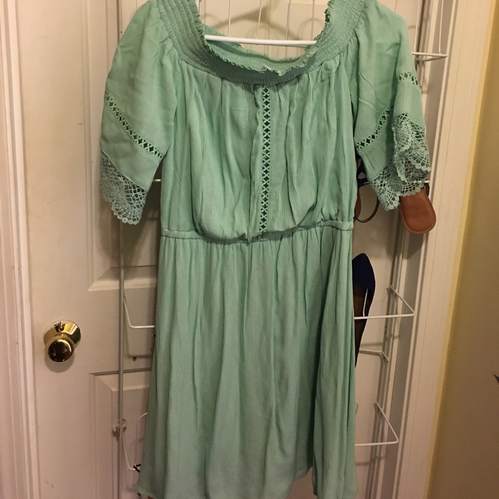 Mint green off the shoulder dress.