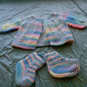 Never worn.... Knitted baby sweater and bootie set
