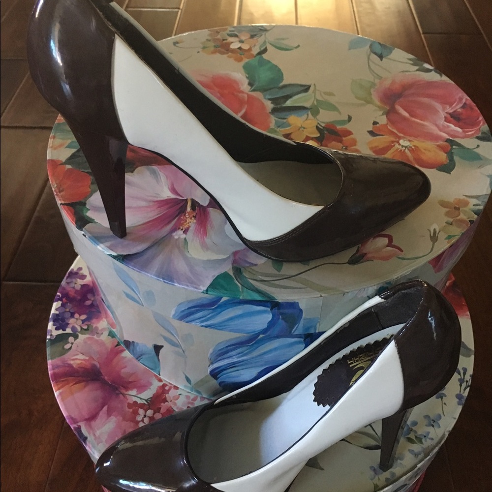 Chocolate brown and white shoes.