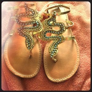 Sandals with snake like design