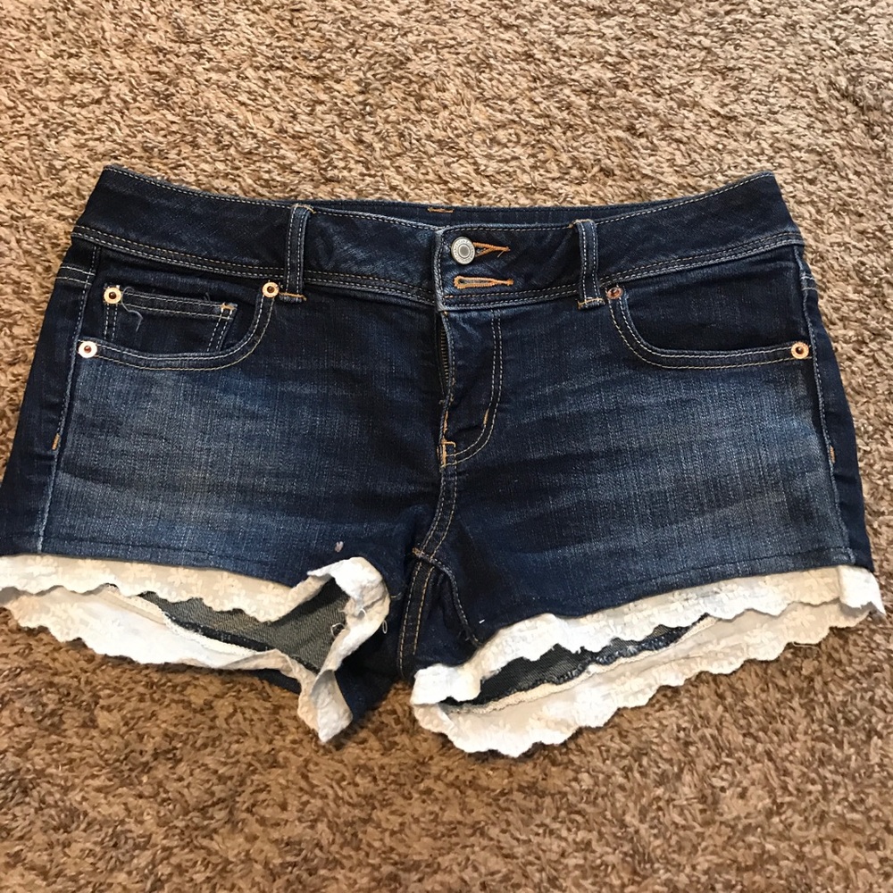Denim shorts with lace hem