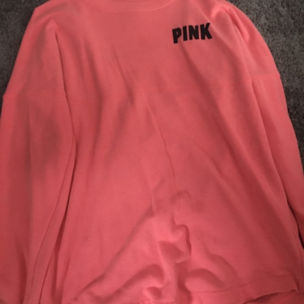 A pink sweat shirt