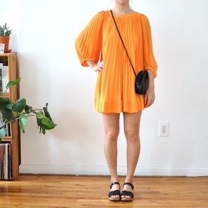 Canary yellow pleated swing dress