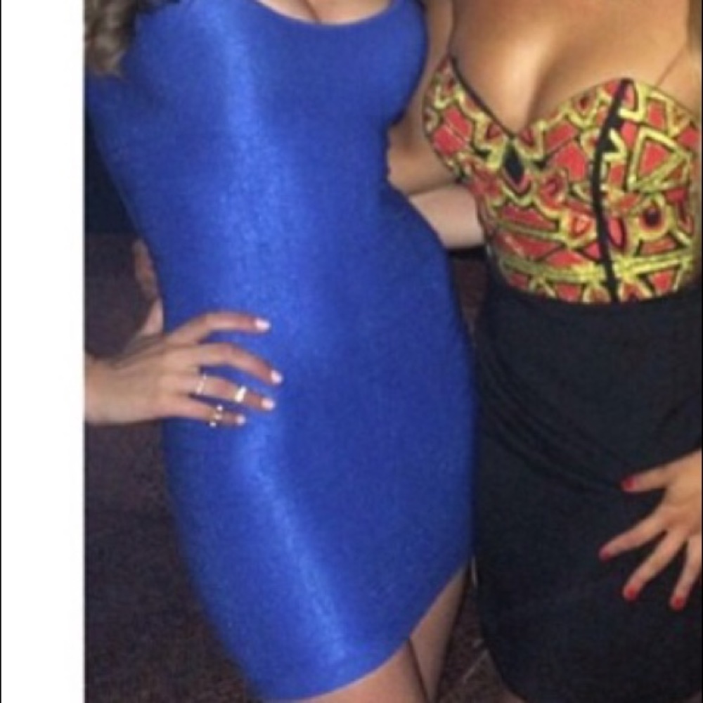 Turn heads in this blue back cutout bebe dress