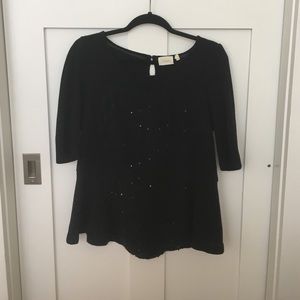Sparkly peplum blouse.