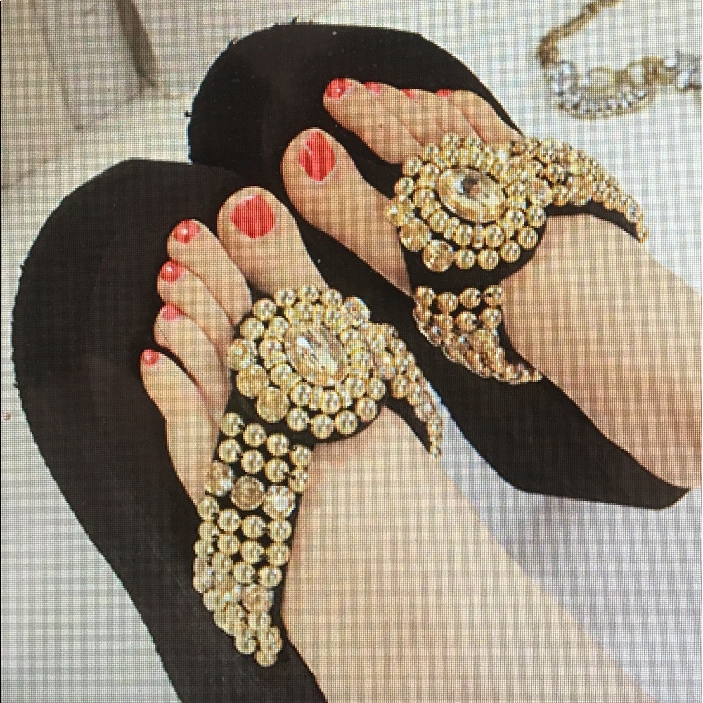 Super fancy gold embellished flip flops.