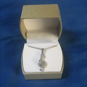 Treble clef necklace