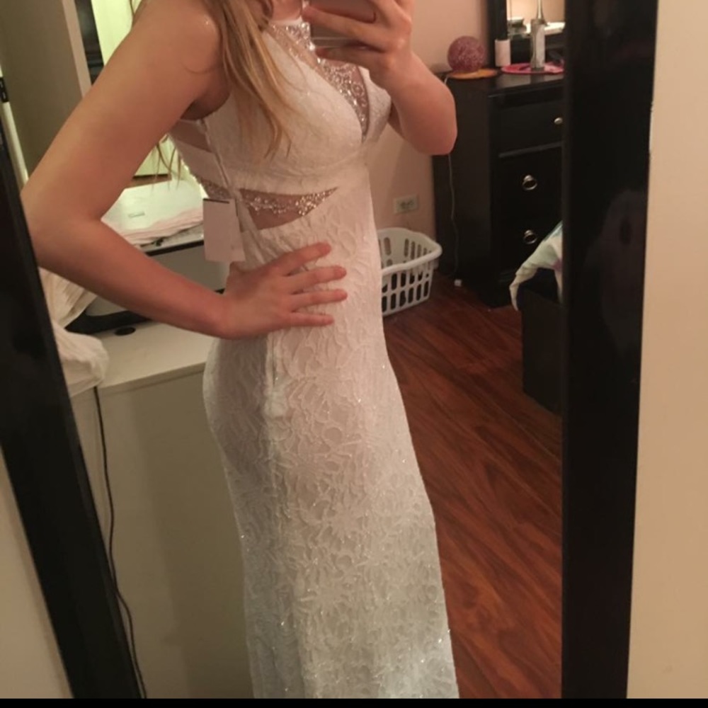 I am selling this beau BNWT White Prom Dress