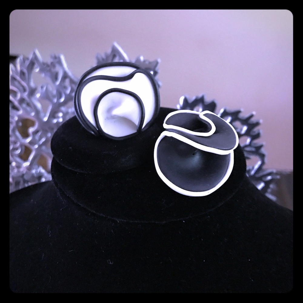 Women's black and white clay rings.